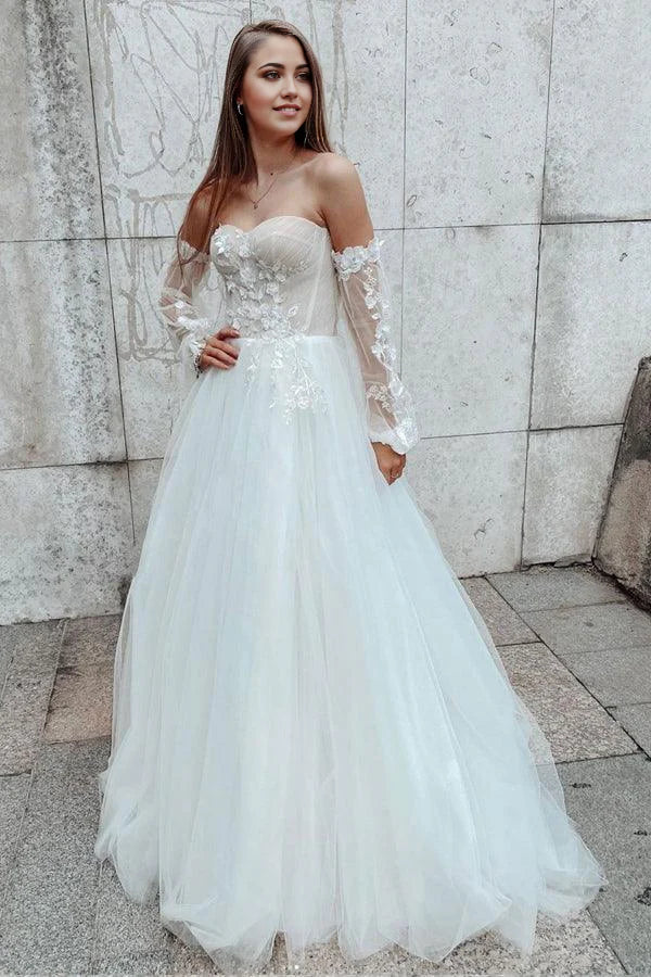 Vestido de novia de encaje con escote en forma de A y mangas desmontables